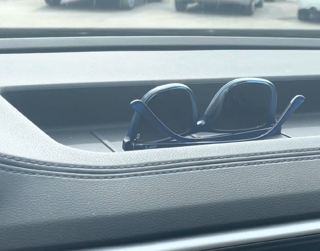 Sunglasses on a dashboard