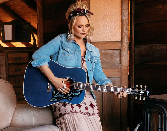 Miranda Lambert holding her signature Bluebird Gibson guitar