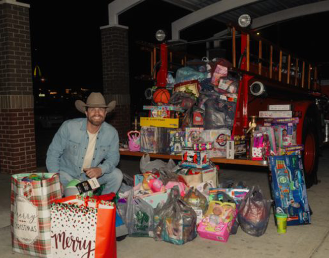 Dustin Lynch with donated toys